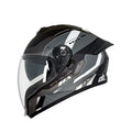 Modern full-face motorcycle helmet with black, gray, and white geometric design and clear visor